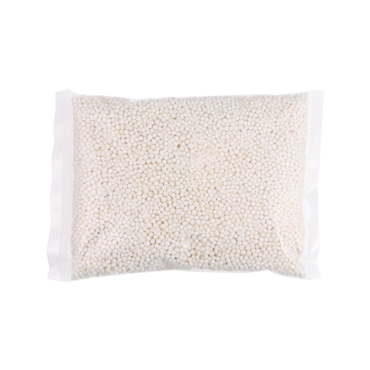 Bag of white tapioca pearls, sealed pouch with small bead-like pearls
