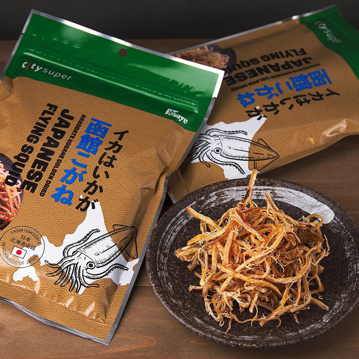 Dried Japanese flying squid pouch with bowl of shredded golden squid