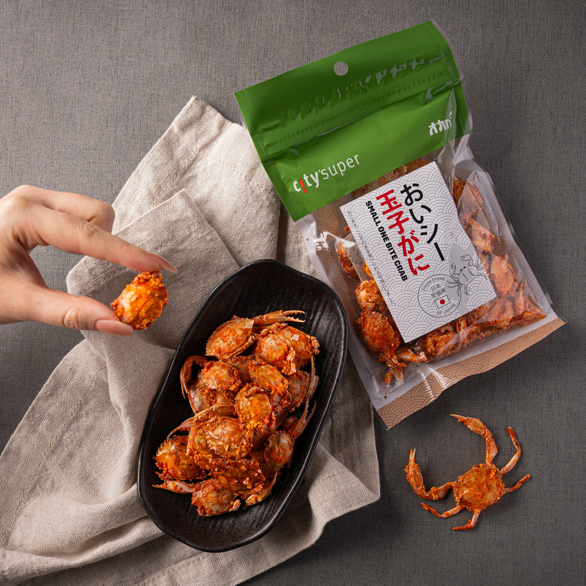 One-bite crab snack bag with packaged crab pieces and bowl of roasted bites