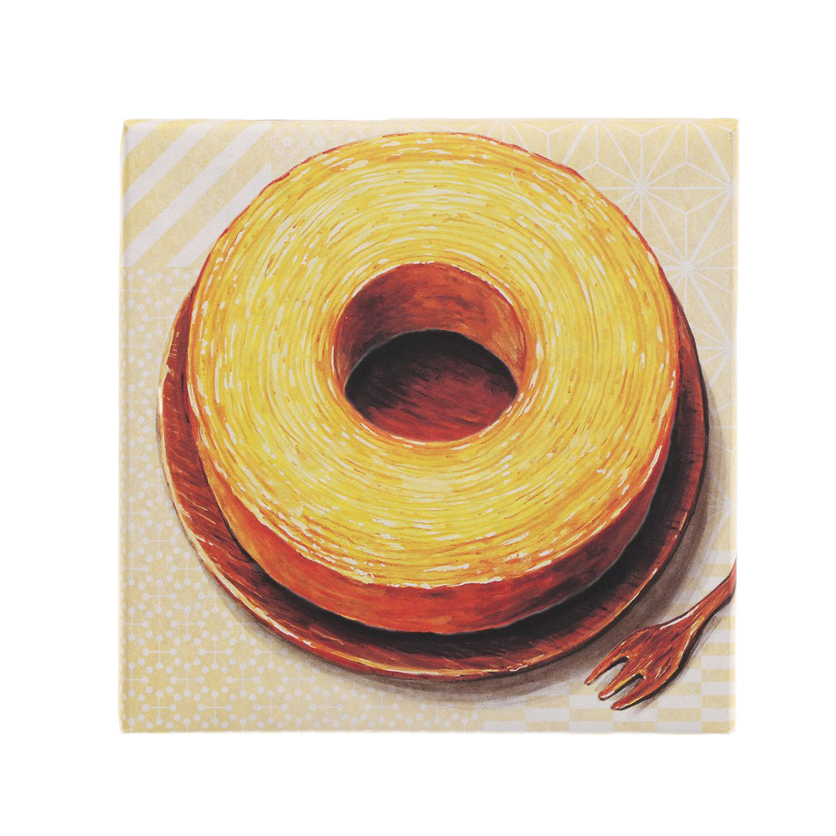 YATARO Baumkuchen spiral cake with golden swirls and dark center, in box