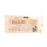 Frozen tofu roll package, pale beige with yellow labeling