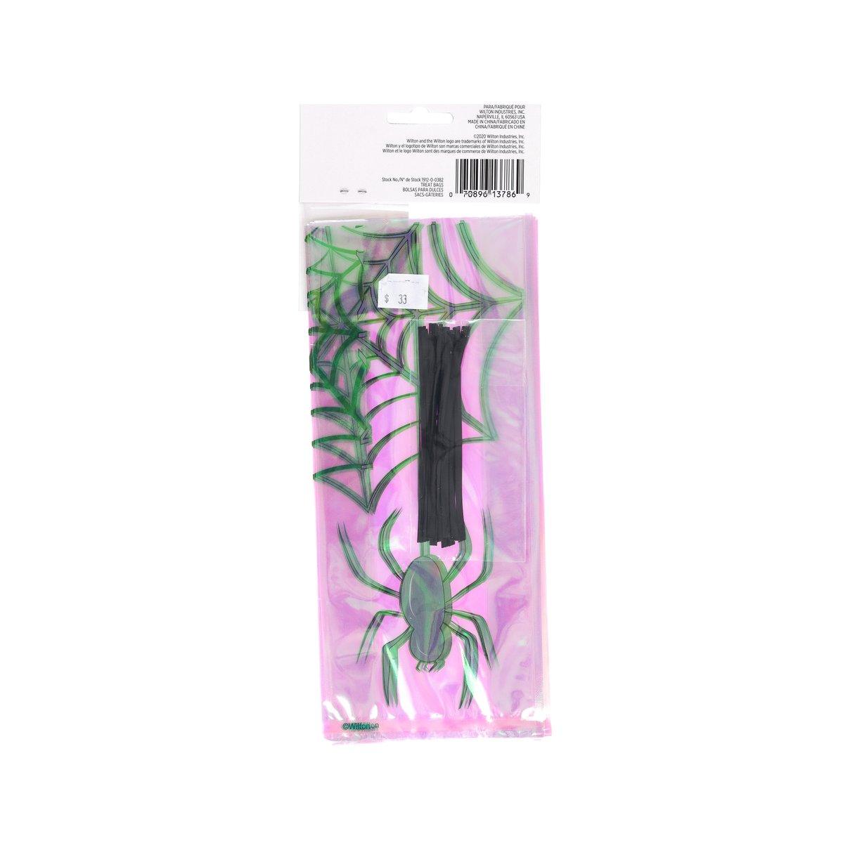Halloween treat bag back view, pink plastic with green spider and web print