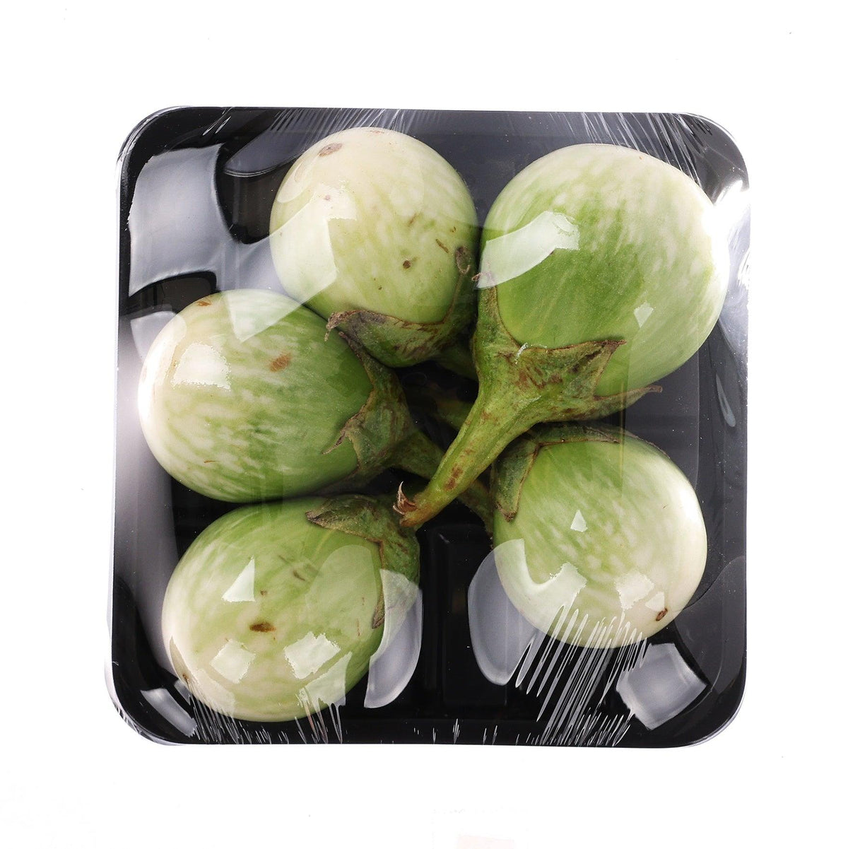 Packaged Thai green eggplant in black tray, oval green with white stripes