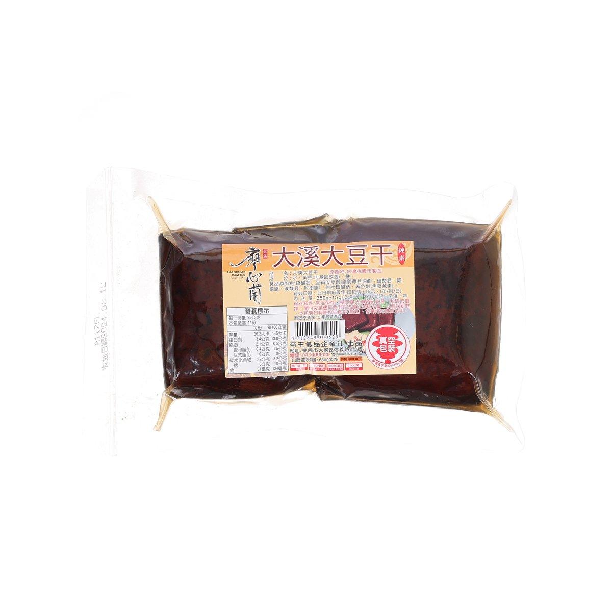 Dried tofu blocks, vacuum-sealed in brown package with label on the front