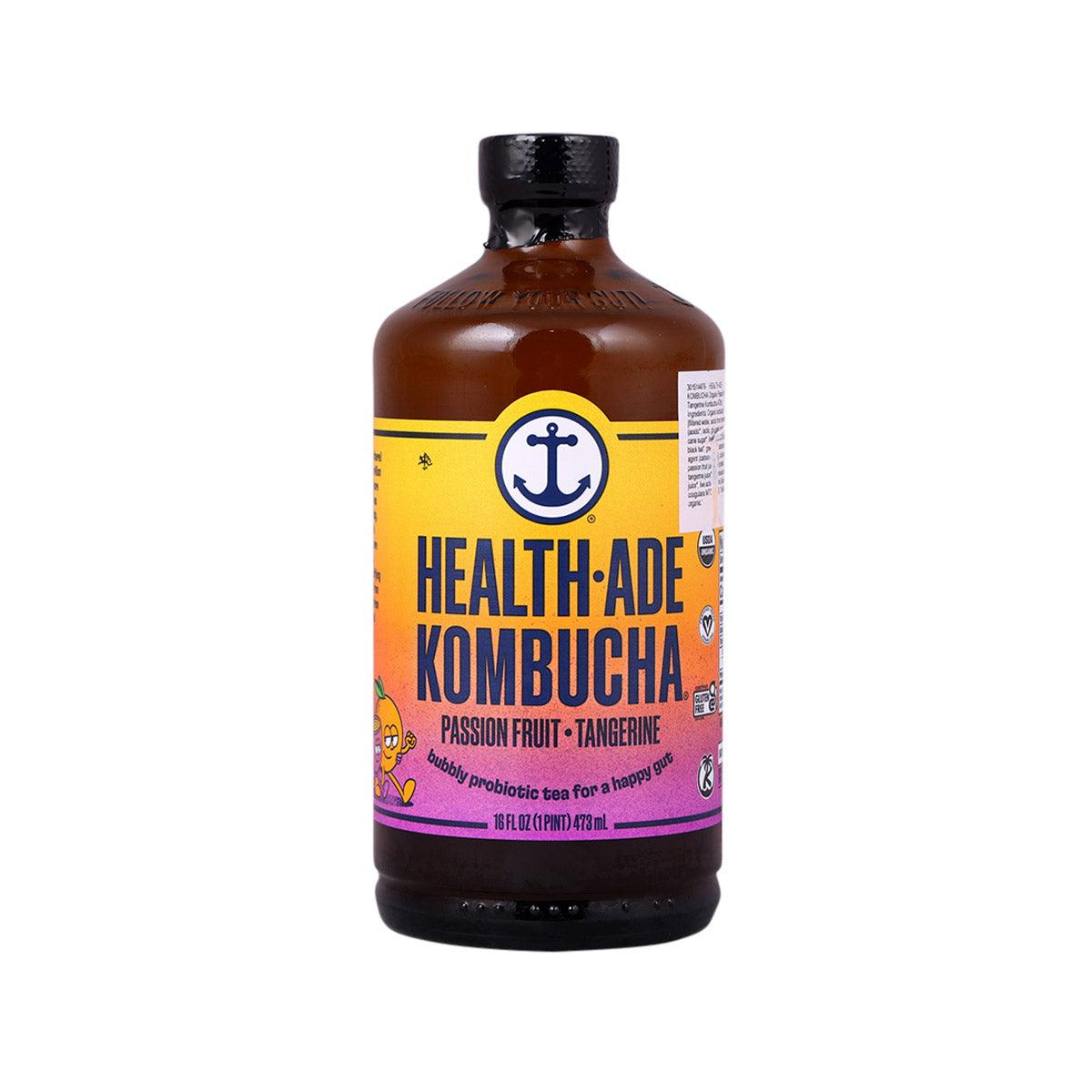 HEALTH-ADE kombucha bottle with passion fruit tangerine label, dark brown glass