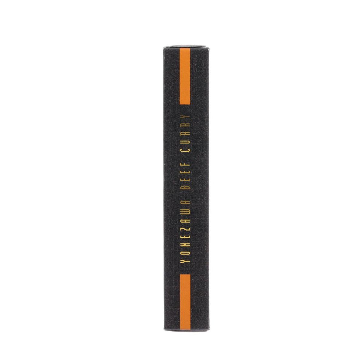 Beef curry carton side view, black with orange stripe and vertical branding