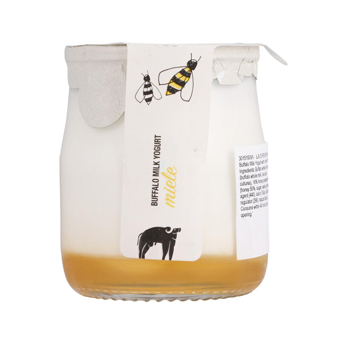 Whole buffalo milk yogurt jar with honey, white label and golden yogurt