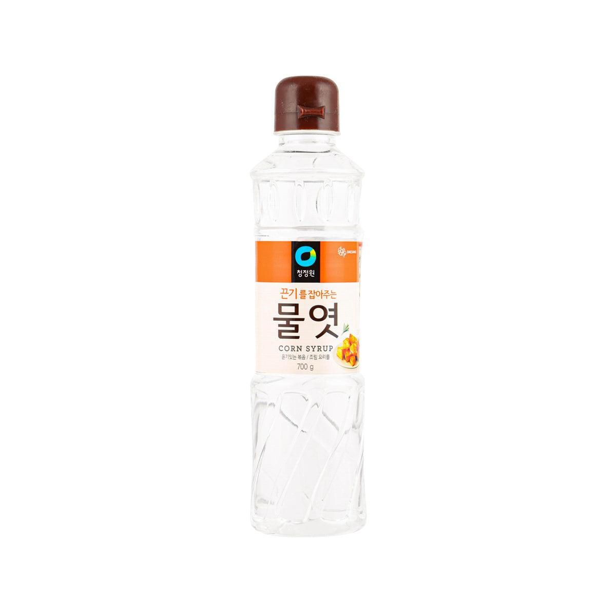 Corn syrup bottle with brown cap and clear body, orange label, 700g size
