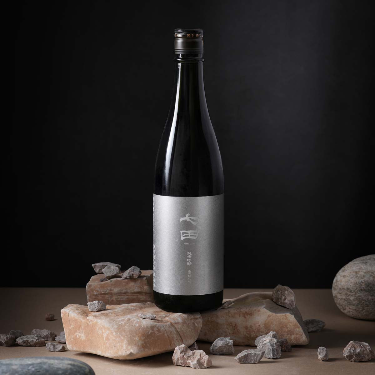 Sake bottle with dark glass and silver label