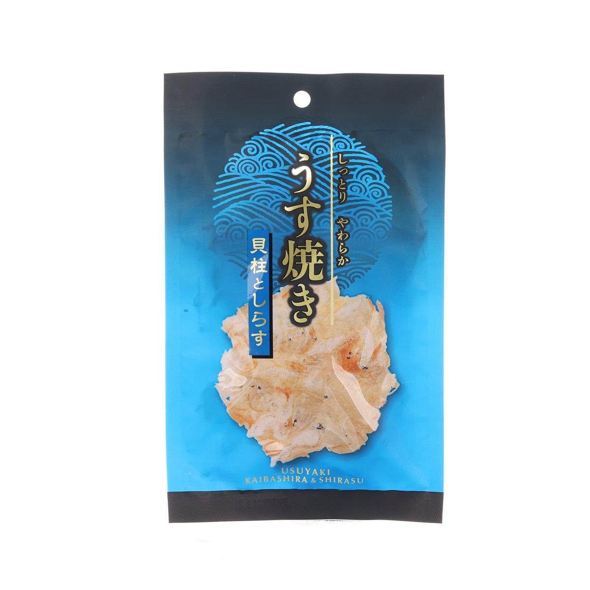 Pressed scallop-shaped shirasu cracker snack bag, blue front with printed label