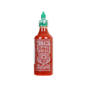 Sriracha hot chili sauce bottle with green cap, red front label