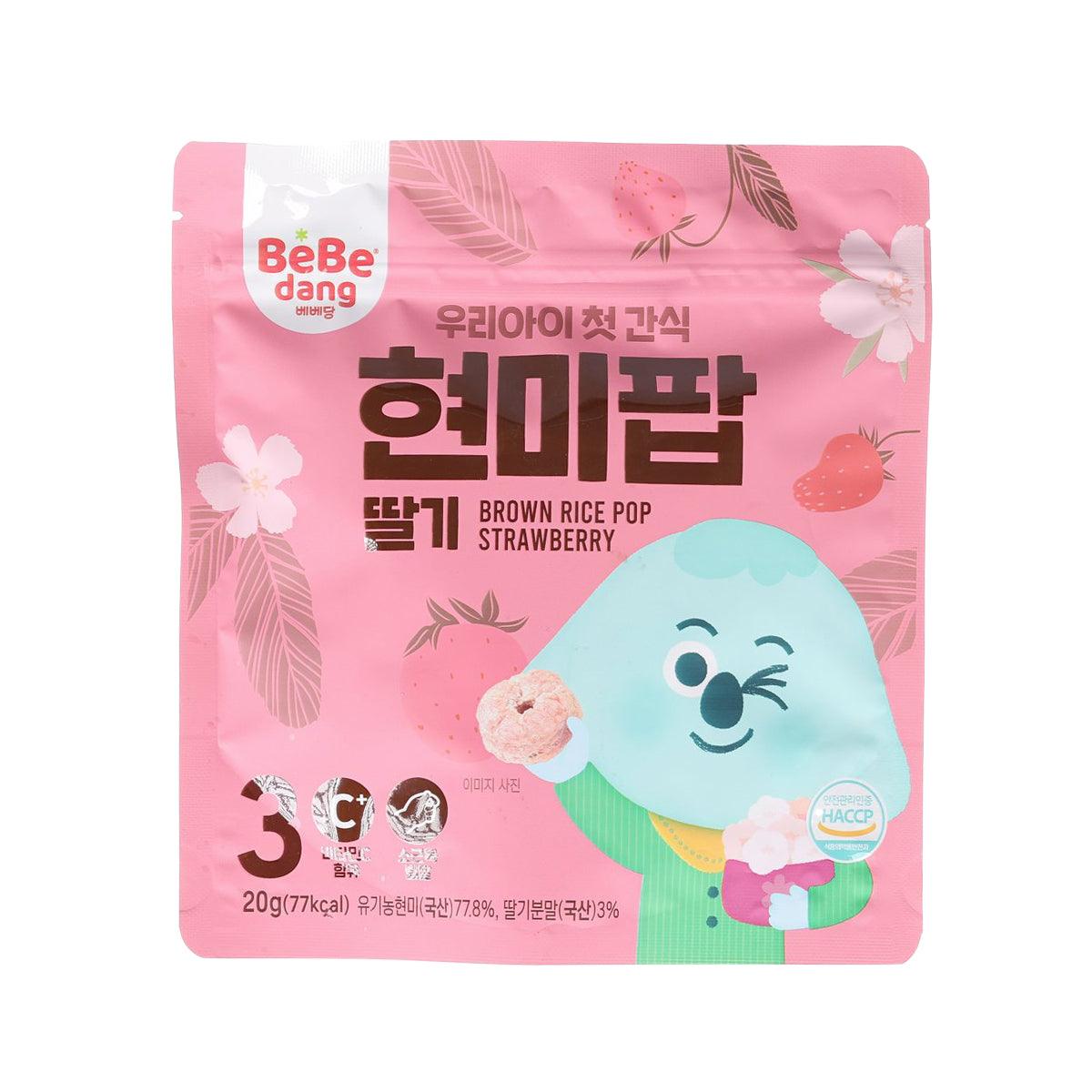 Strawberry brown rice pop snack pouch, pink front with cartoon character and brand logo