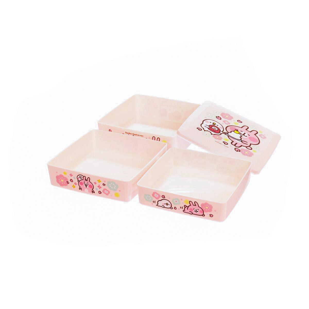 Pink candy box with open compartments and animal character prints on trays