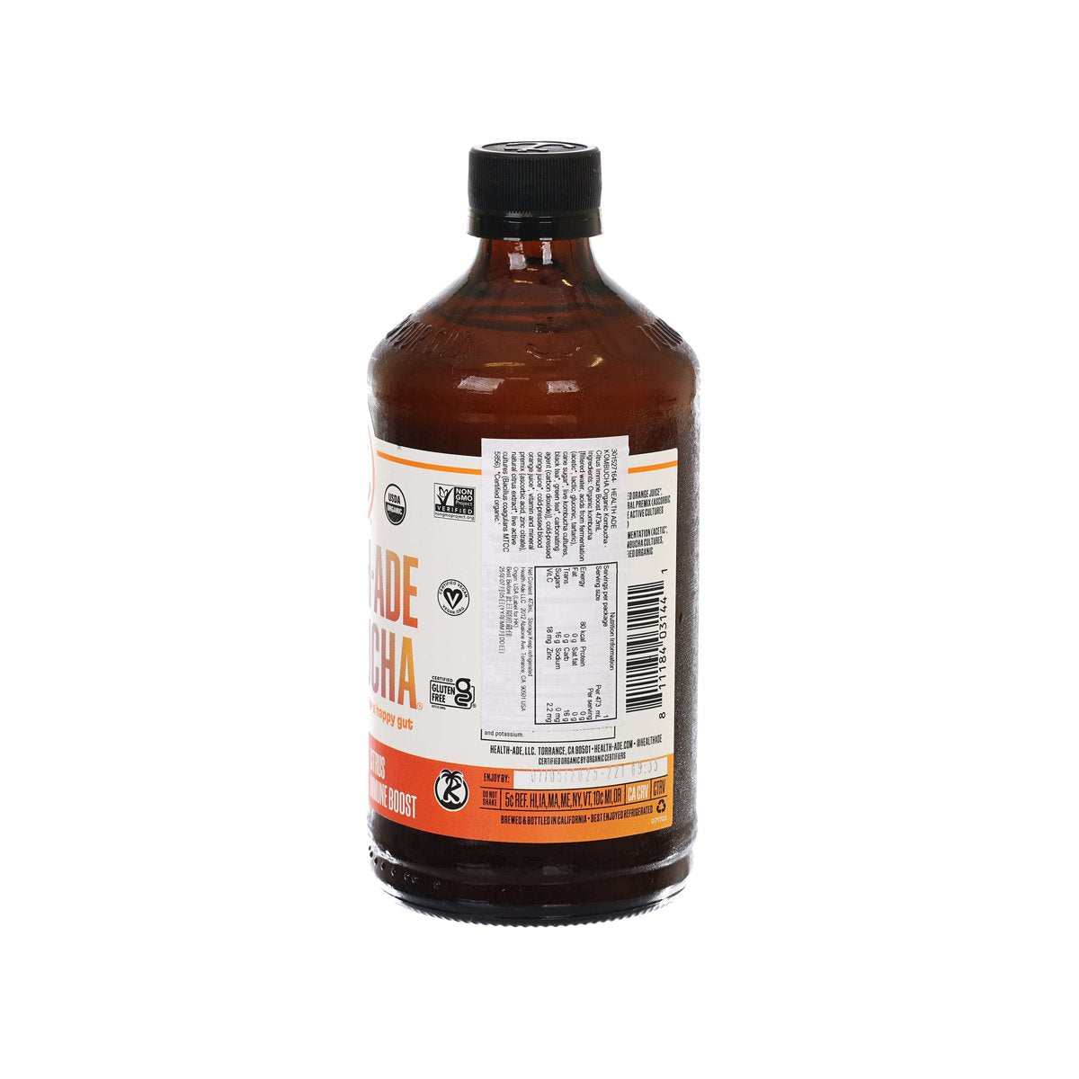 Amber kombucha bottle with Nutrition Facts, barcode, and black cap