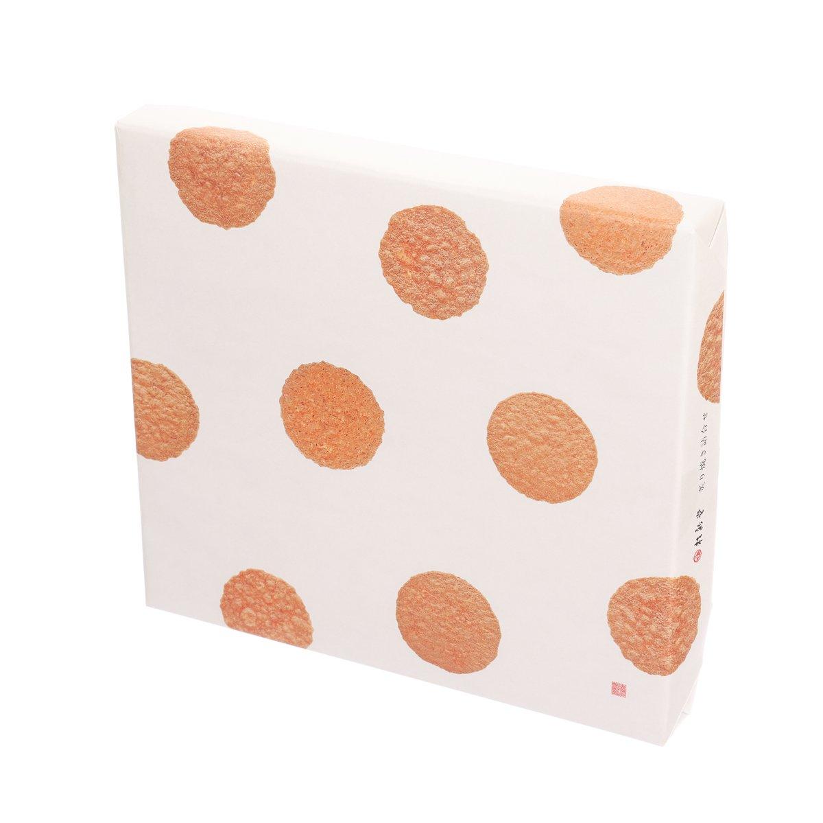 Shrimp cracker assortment box, angled view, orange circular dots on white
