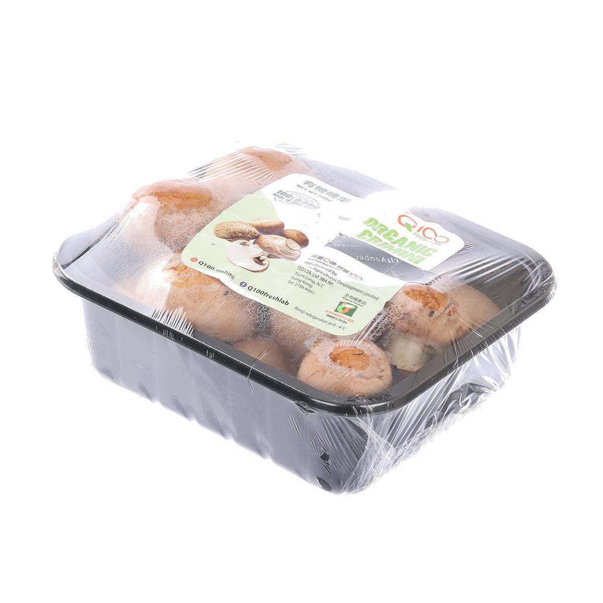 Organic crimini mushrooms in clear plastic tray, angled view of 200 g package