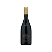 DIORA Syrah red wine bottle with gold label on dark glass