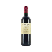 Wine bottle with dark red foil cap and cream front label