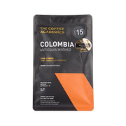 Black coffee pouch with orange panel, 'Colombia Antioquia Washed' and 1/5 badge