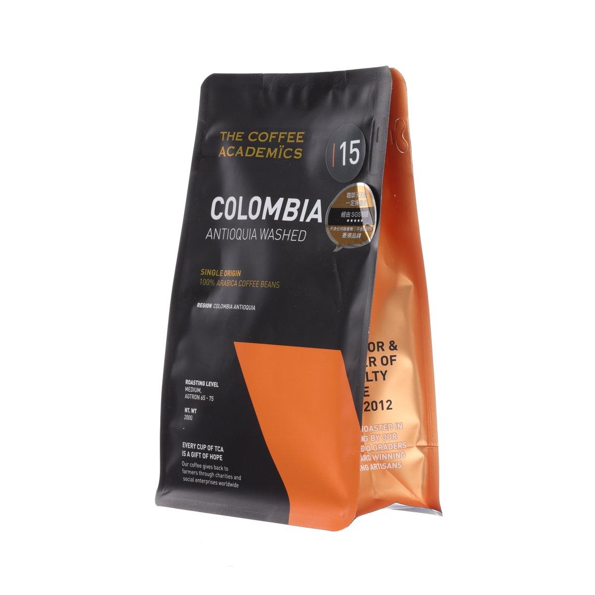 Black coffee pouch with orange side stripe and 'Colombia Antioquia Washed' front text