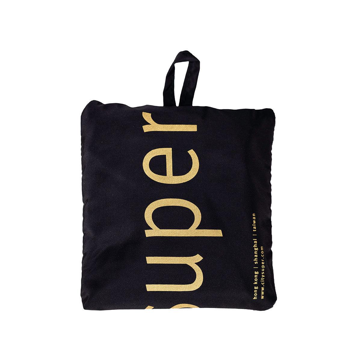 Black pocketable shoulder bag with gold vertical lettering and top carry handle