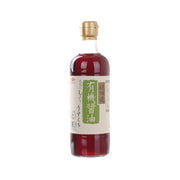 Organic light soy sauce bottle with gold cap and front label on red glass