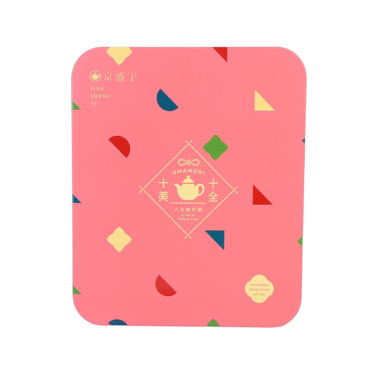 Pink square tea tin with colorful geometric pattern and omamori-themed emblem on lid