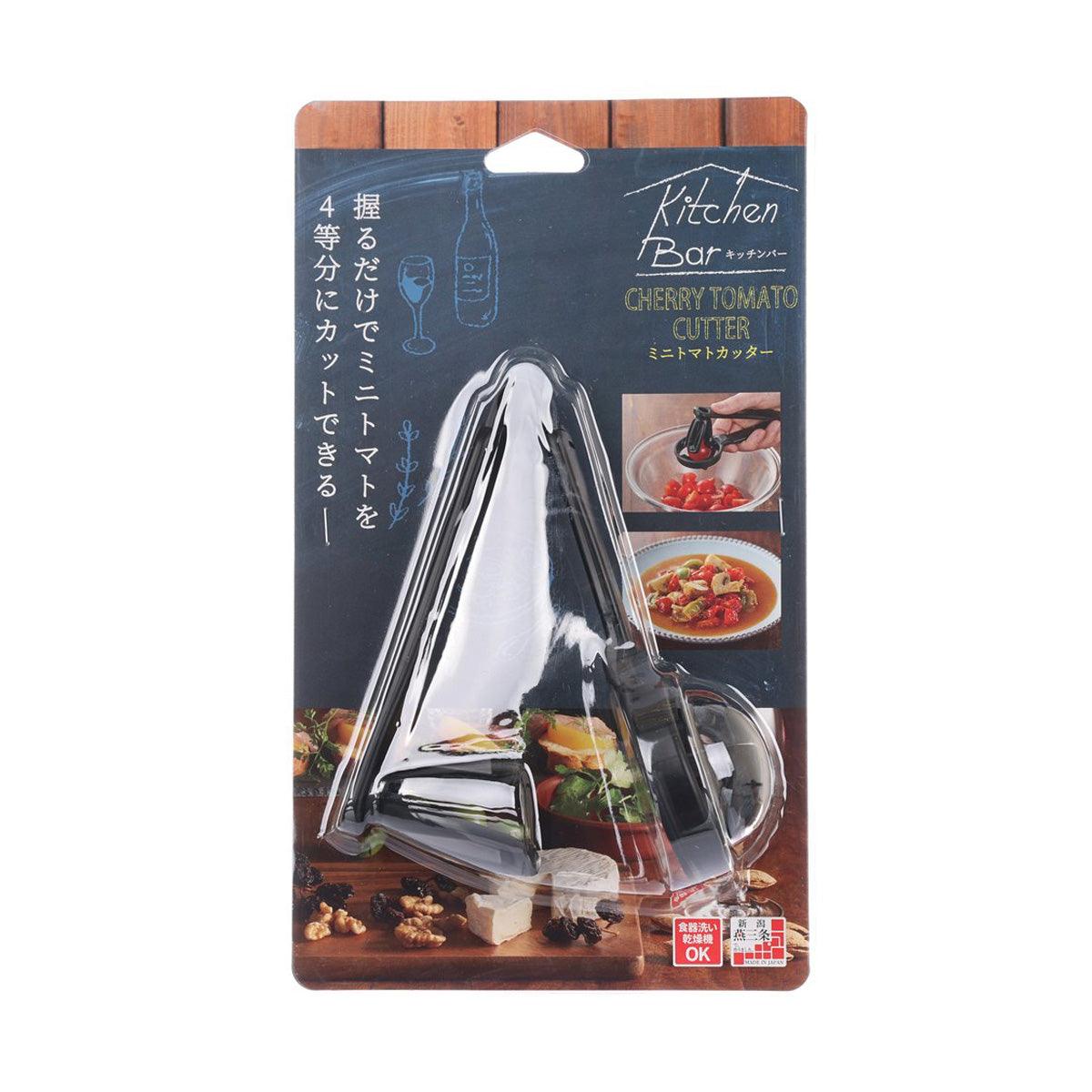 Cherry tomato cutter utensil in clear blister pack, metallic blade and dark handle