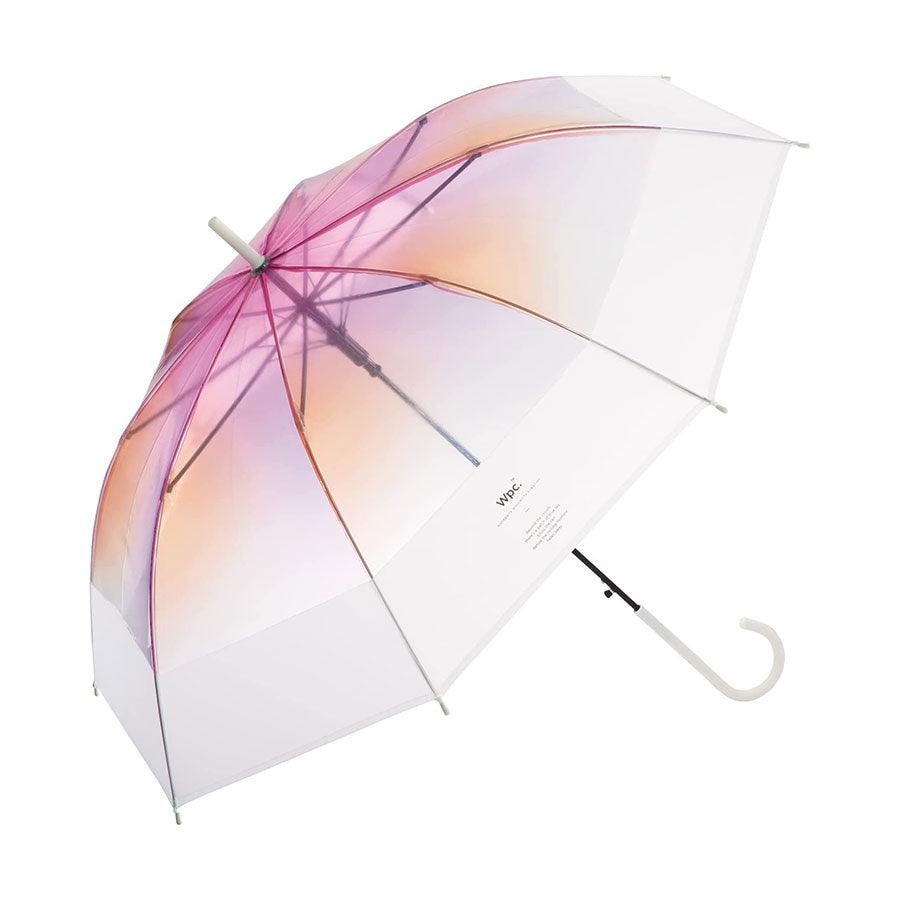 Pink gradient transparent umbrella with curved handle and clear ribs