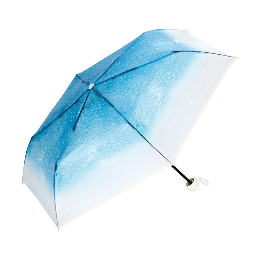 Mini blue gradient umbrella with clear panels and curved white handle