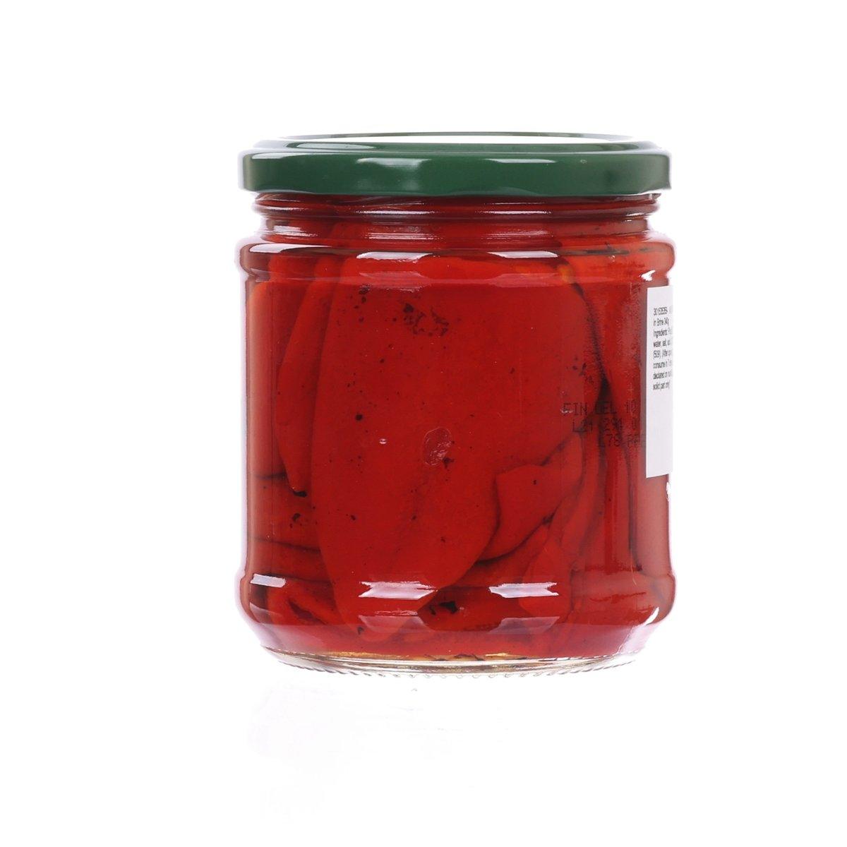 Glass jar of red piquillo peppers in brine with green lid