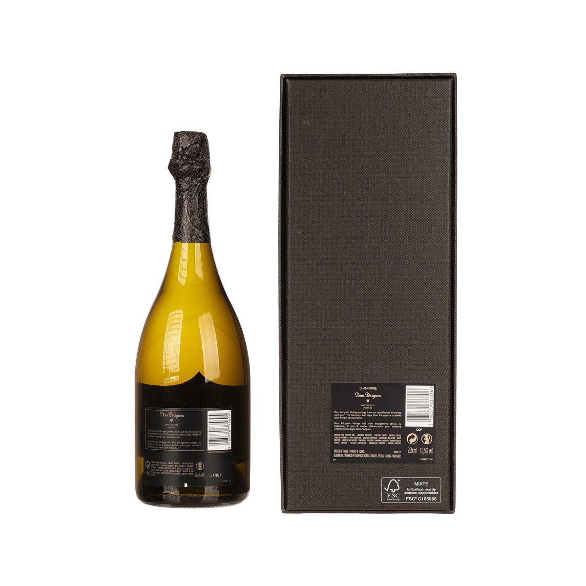 Dom Pérignon Vintage 2015 champagne bottle beside black presentation box