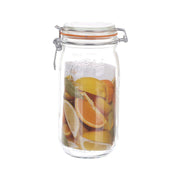 Glass sealed bottle with swing-top lid, filled with orange fruit slices