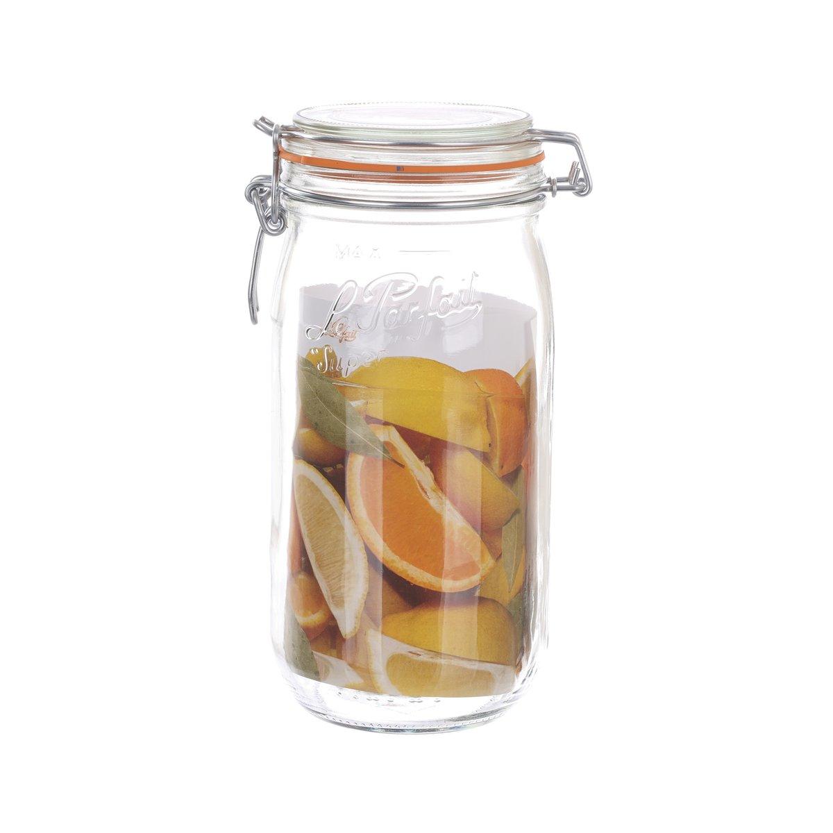 Glass sealed bottle with swing-top lid, filled with orange fruit slices