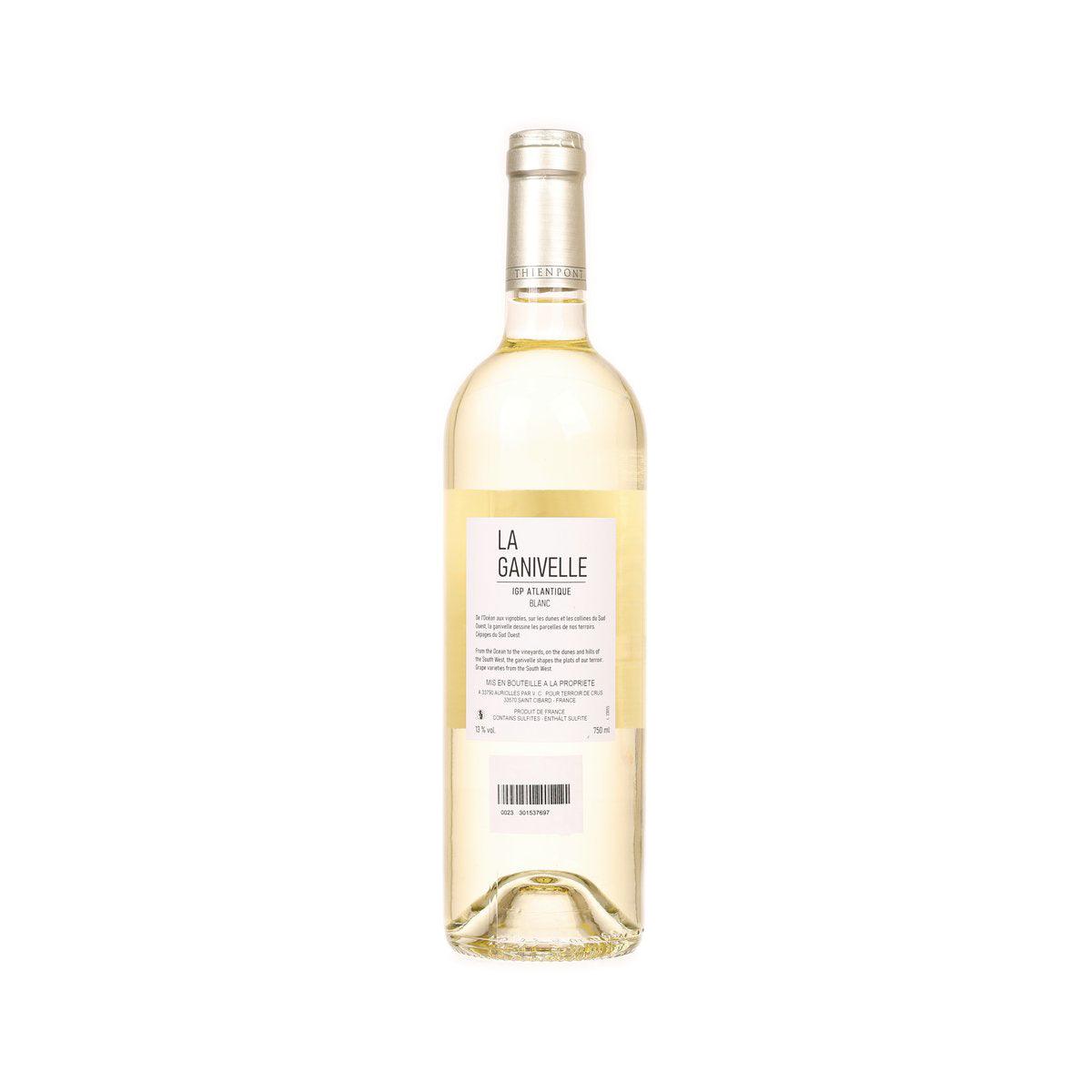 White wine bottle with gold cap, back label and pale yellow liquid