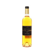 Sauternes wine bottle, gold glass with black label and black foil cap