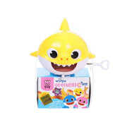 Yellow shark-shaped toy attached to baby candy box, cartoon eyes and open mouth