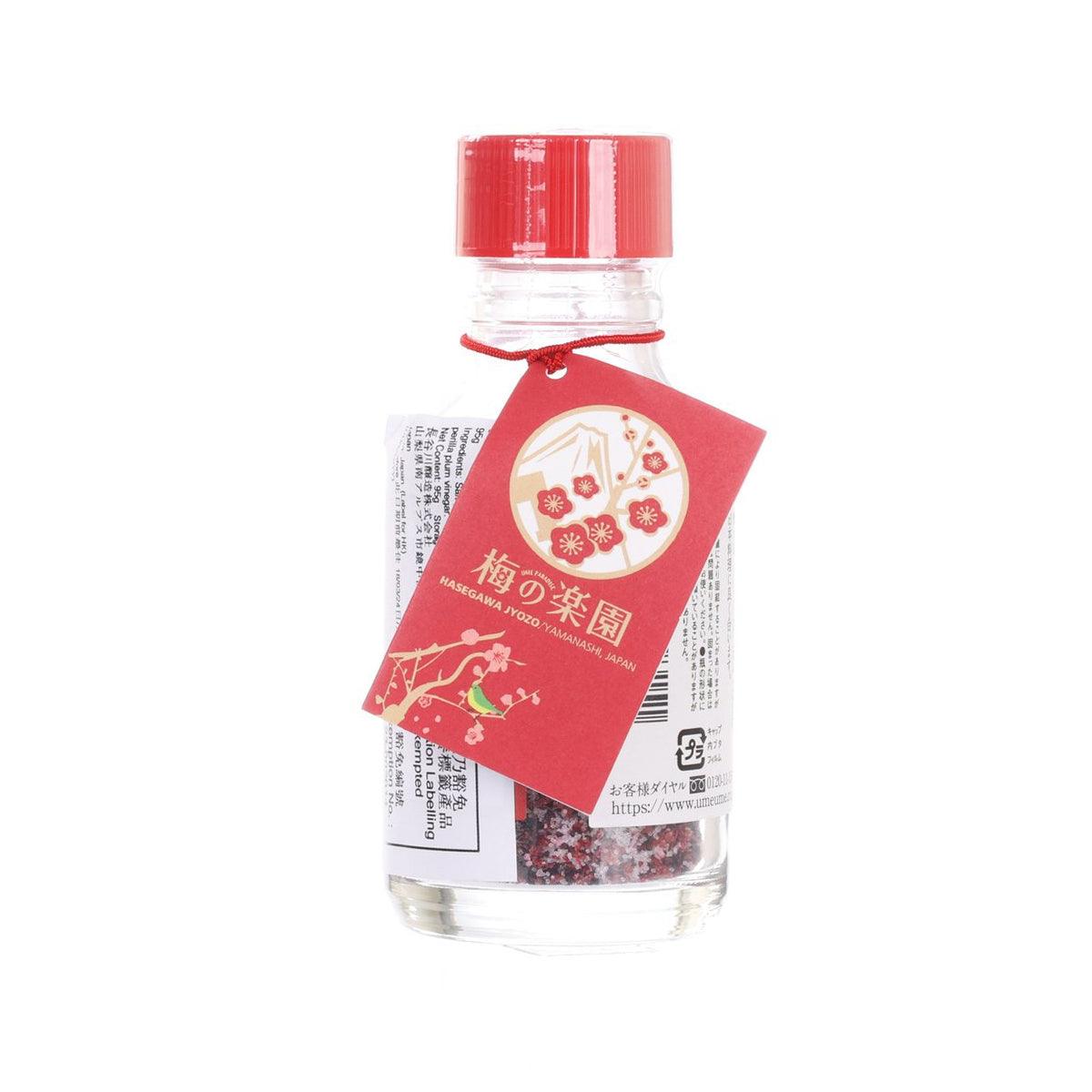 Plum salt seasoning bottle with red cap and red tag label