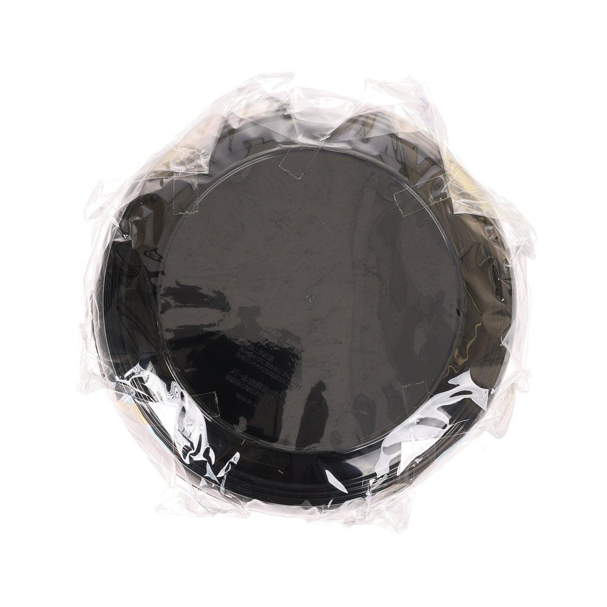 Black round noodle bowl in clear plastic wrap