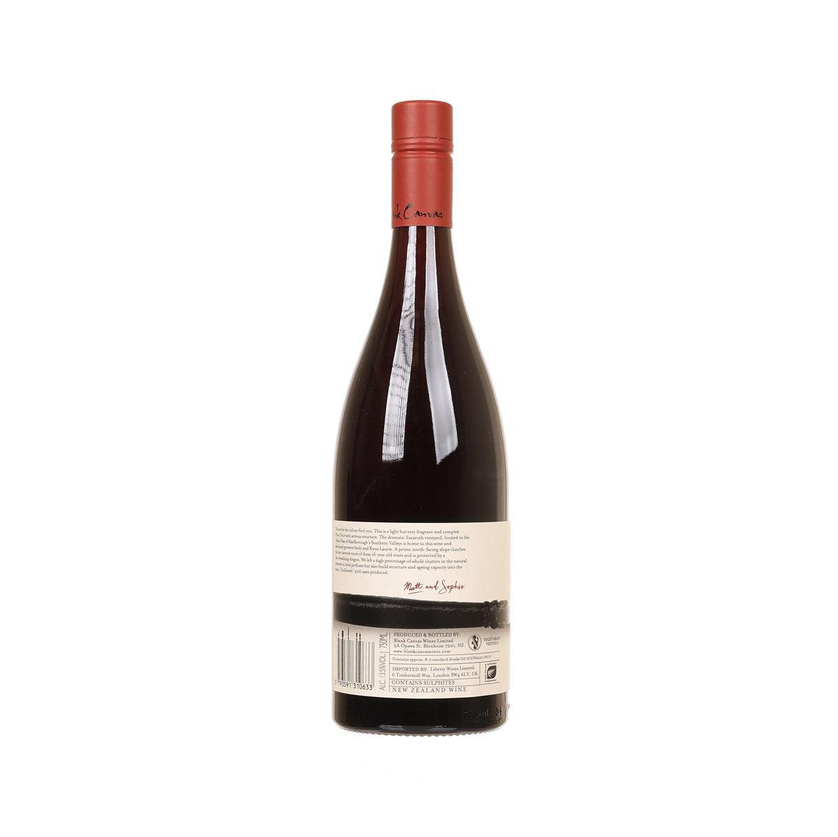 Pinot noir wine bottle with red foil cap and back label