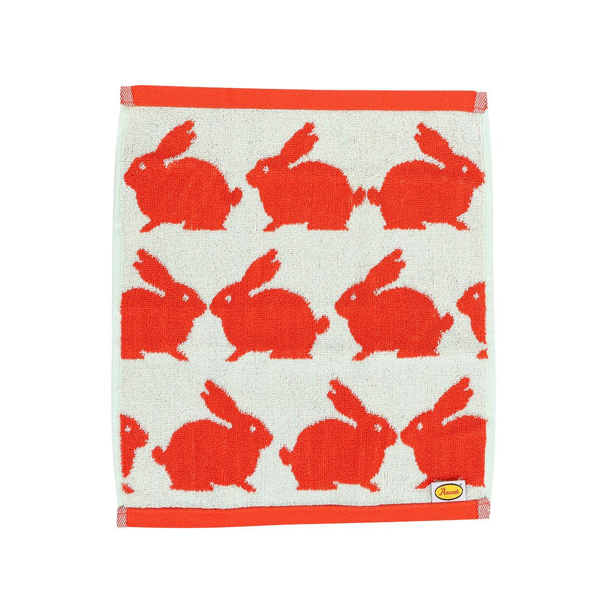 Cream cotton wash towel with red rabbit print and red top and bottom trim
