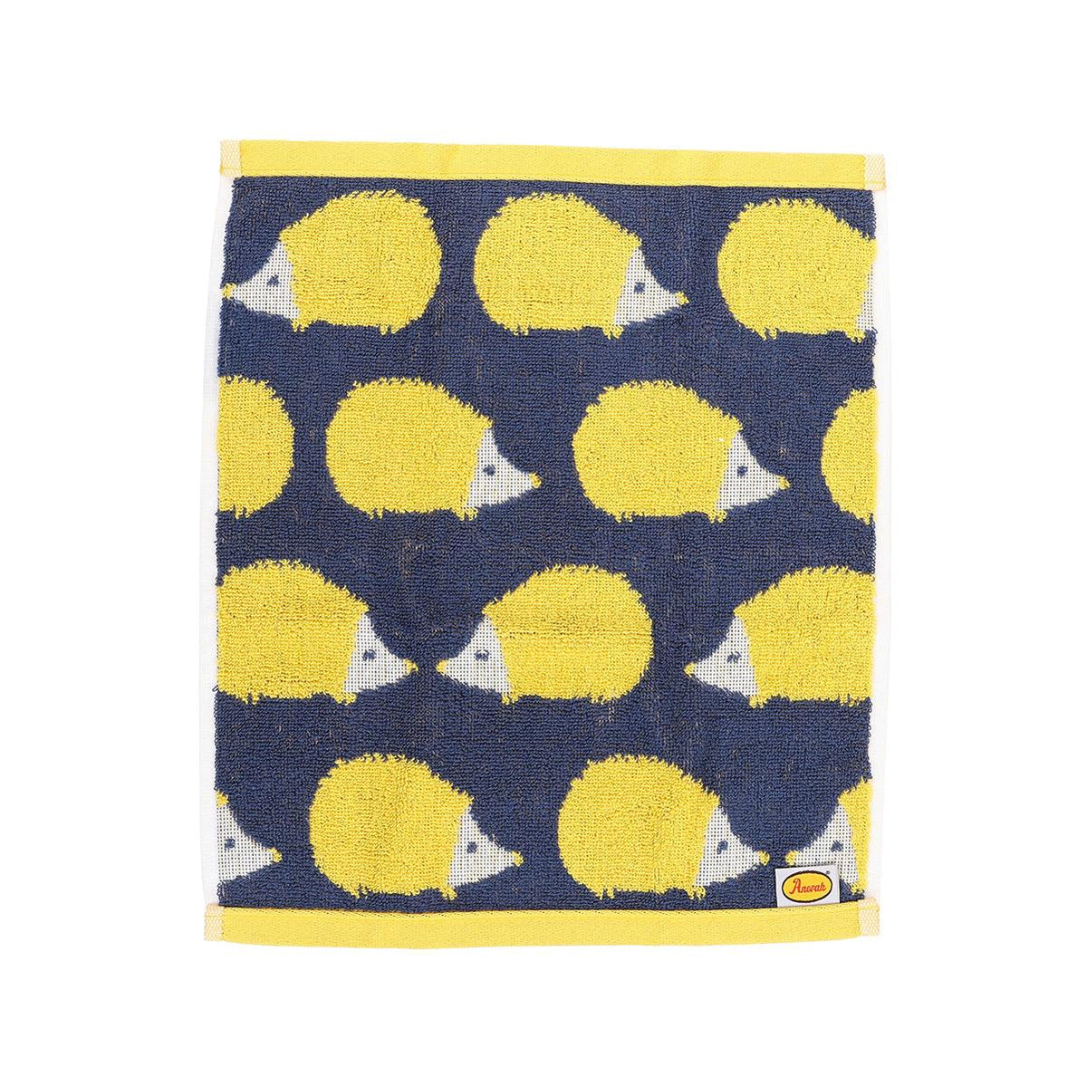 Navy cotton wash towel with yellow animal pattern and cream border trim