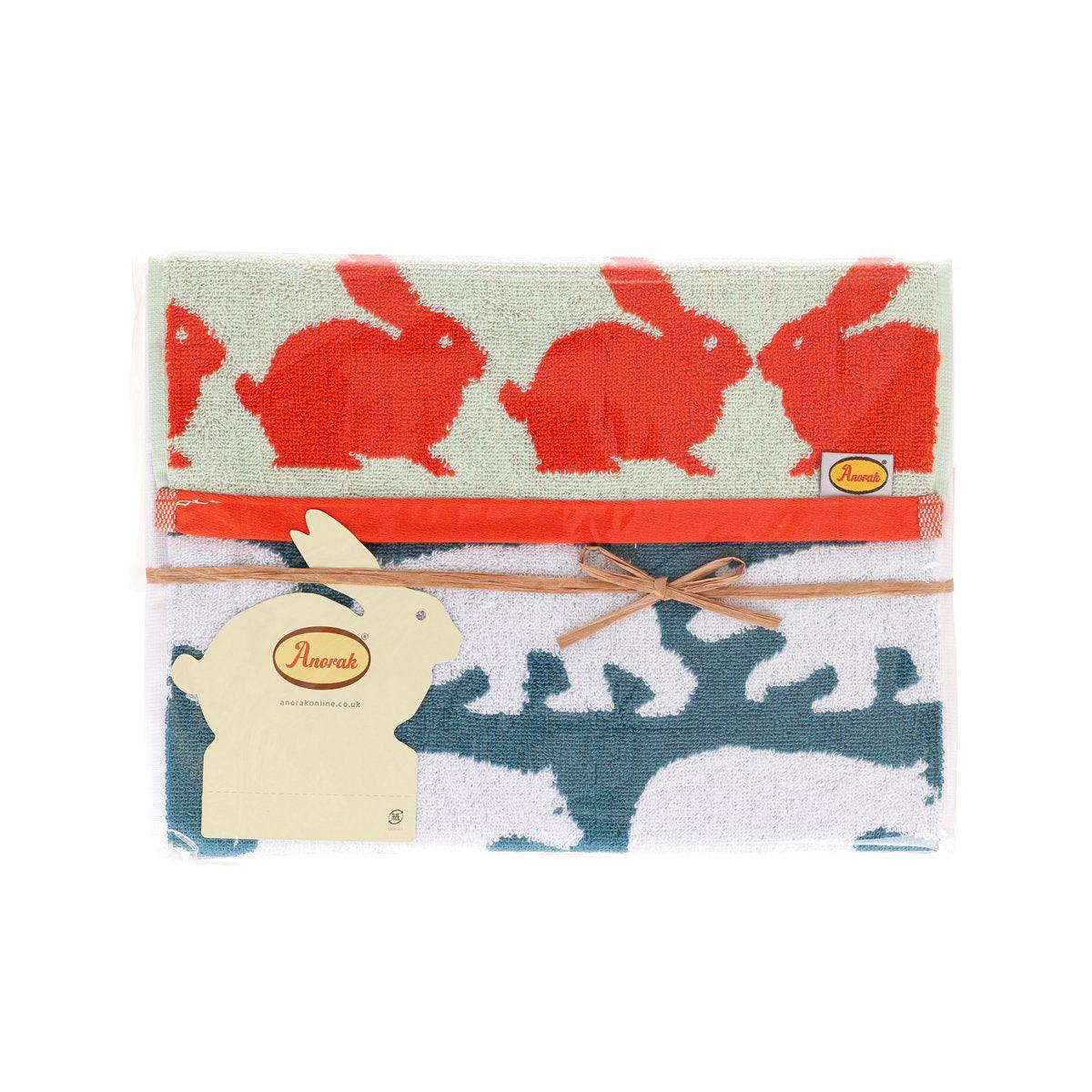 Cotton towel set, red and blue animal prints, folded with Anorak logo label