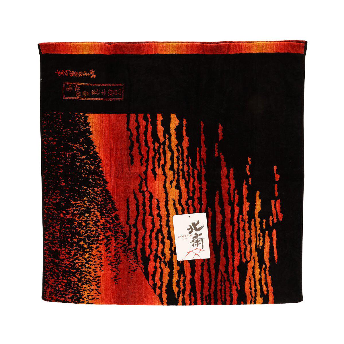 Bath towel with red-orange and black abstract pattern and fabric label, 70x140 cm
