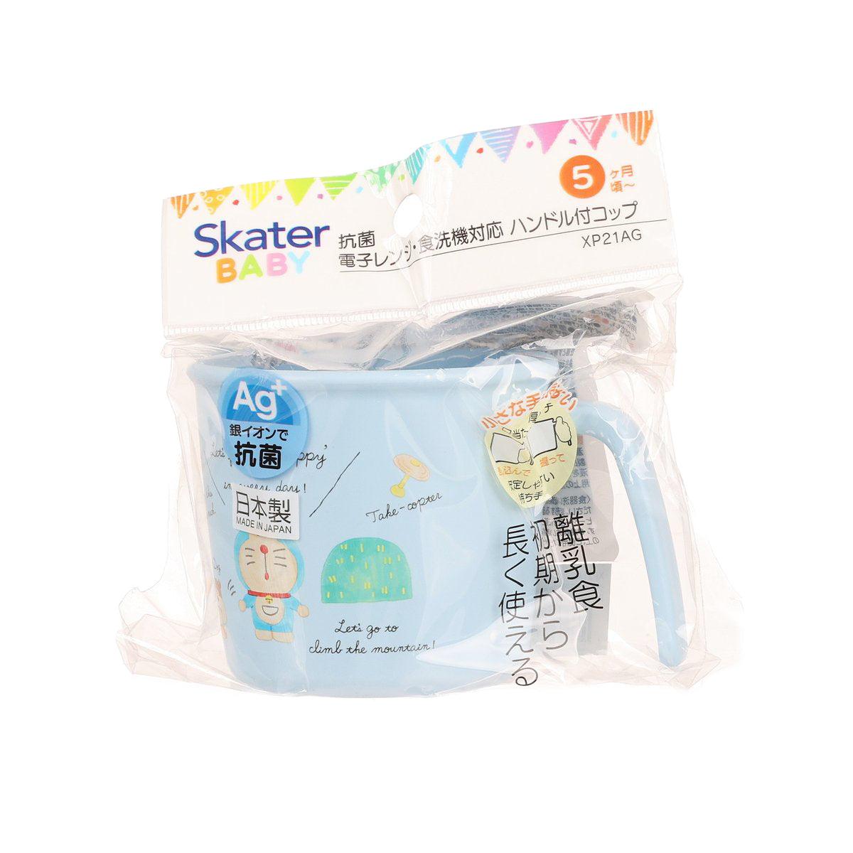 Baby Doraemon anti-bacterial cup with blue handle, sealed in retail bag