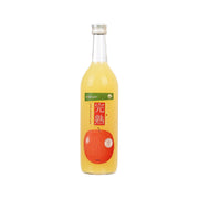 Apple juice bottle with amber liquid, screw cap, and front label with red apple graphic