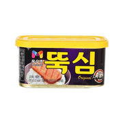 Ham luncheon meat in a yellow-lid can with colorful front label