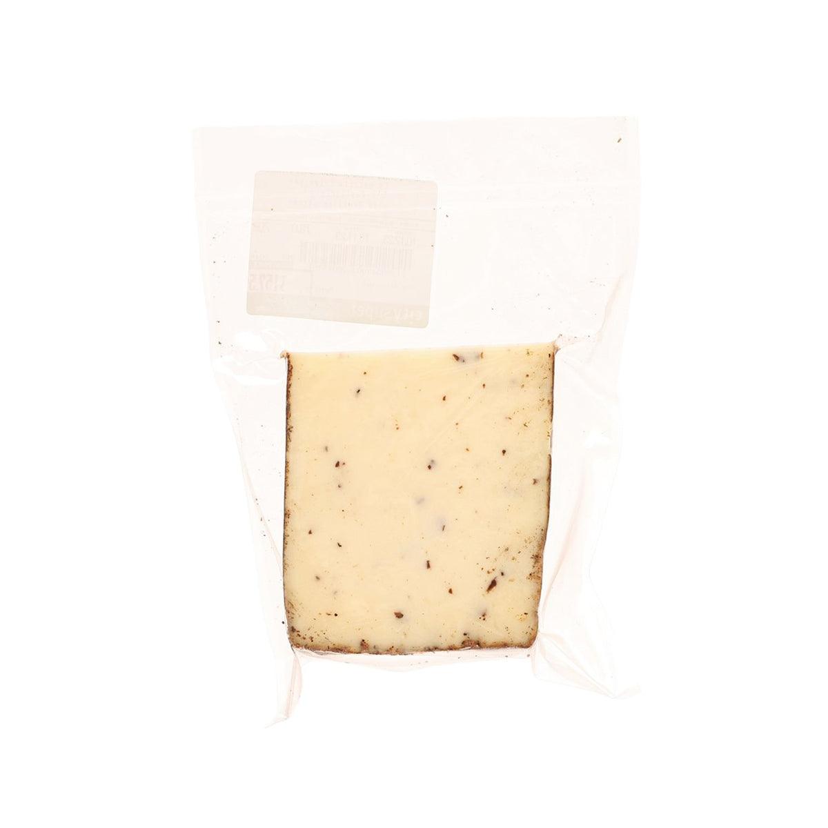 Perlagrigia truffles cheese wedge with white label window, pale yellow and dark specks