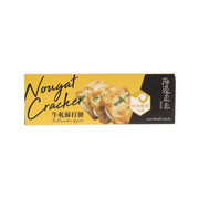 Milk nougat cracker box with illustrated crackers on yellow and black packaging