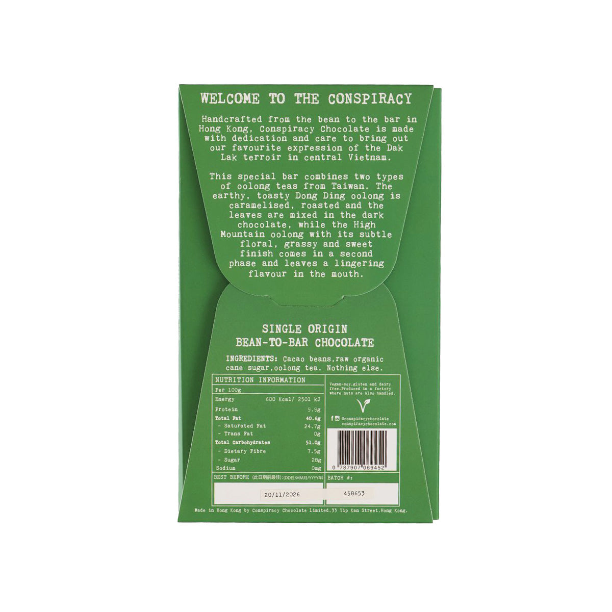 Dark chocolate bar wrapper back with ingredient and batch information text, green